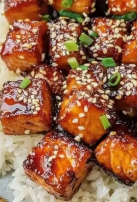 Crispy honey garlic salmon bites served on a platter
