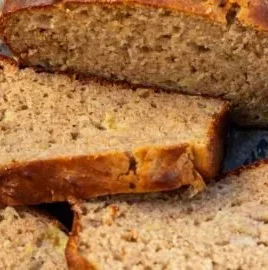 Easy homemade Greek yogurt banana bread loaf on a wooden table