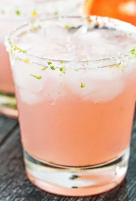 Refreshing Keto Paloma cocktail served in a glass with lime and grapefruit flavors.