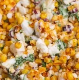 Delicious esquites corn salad served in a bowl with garnishes