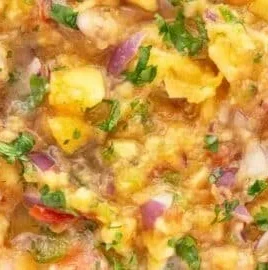 Fresh peach salsa recipe with sweet and savory flavors served in a bowl.