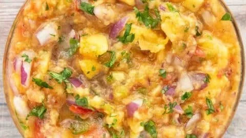 Fresh peach salsa recipe with sweet and savory flavors served in a bowl.