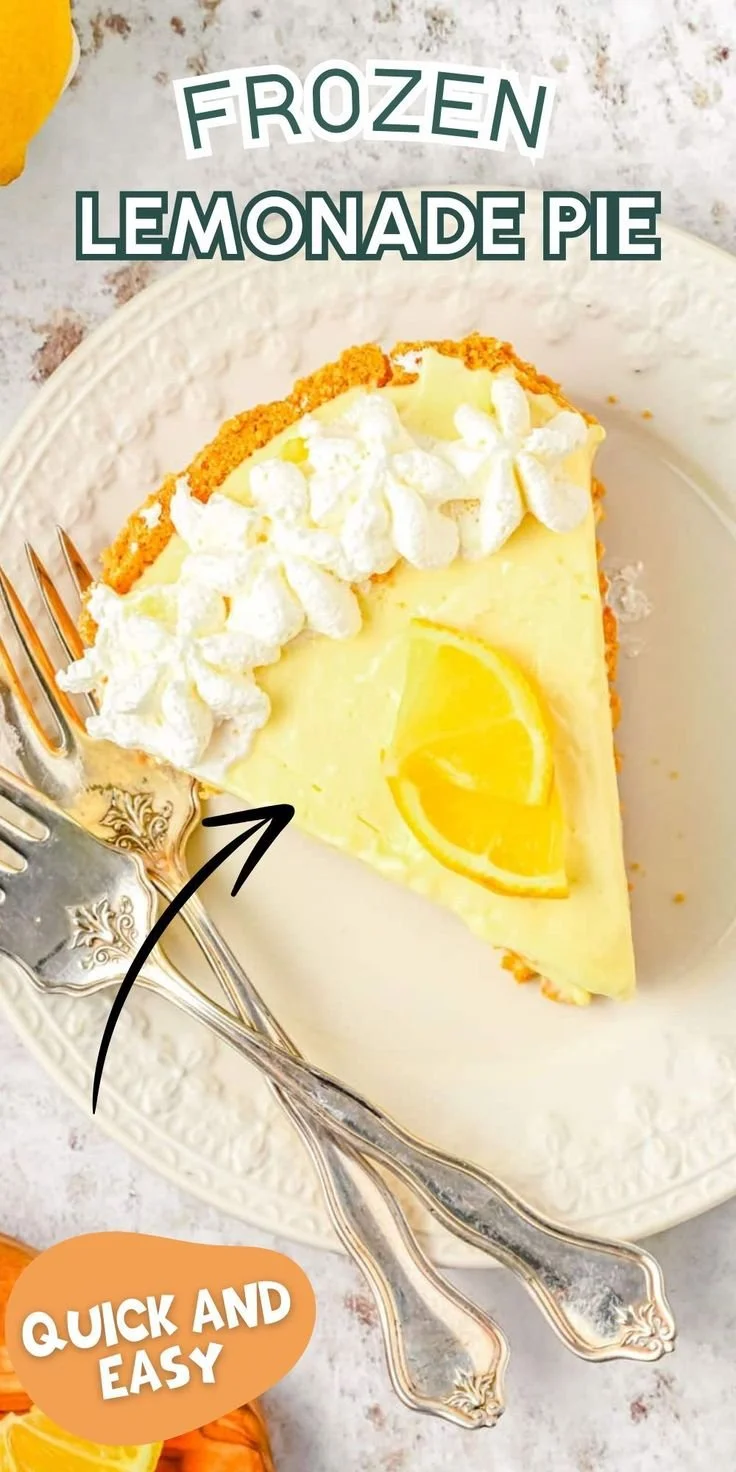 Delicious Frozen Lemonade Pie topped with whipped cream and lemon slices