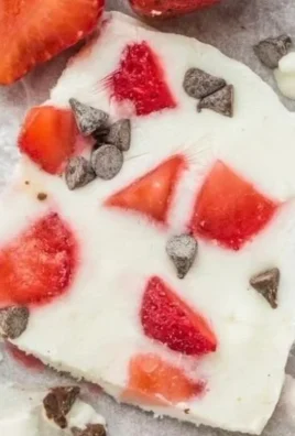 Delicious frozen yogurt strawberry treat served in a cup with fresh strawberries.