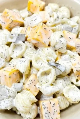 Bowl of homemade dill pickle pasta salad with fresh ingredients