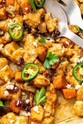 Hot honey chicken sheet pan with vegetables ready to serve.