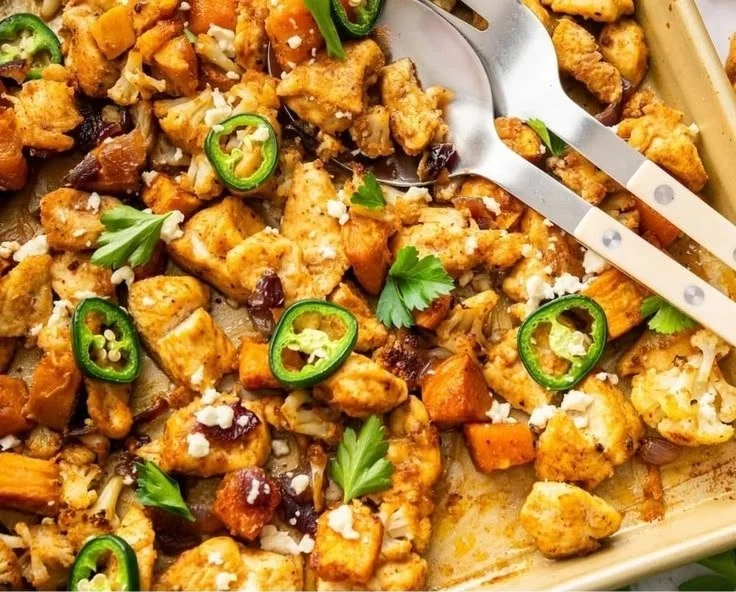 Hot honey chicken sheet pan with vegetables ready to serve.
