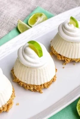 Mini no-bake key lime pies served on a plate with lime slices