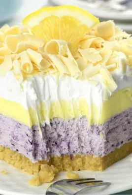 Lemon blueberry lasagna dessert with layers of lemon cream and blueberries