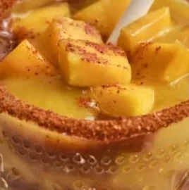 Mango Nacho dish with colorful toppings and fresh mango slices