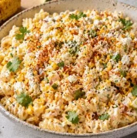 Bowl of Mexican Street Corn Pasta Salad with colorful ingredients.