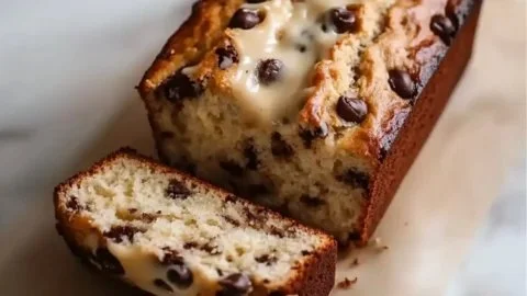 Slice of moist Greek yogurt banana bread on a plate