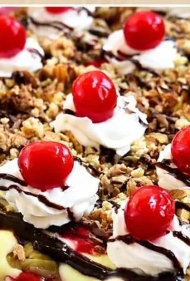 No Bake Banana Split Dessert with layers of bananas, ice cream, and whipped cream