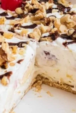 Delicious no bake banana split dessert topped with cherries and whipped cream