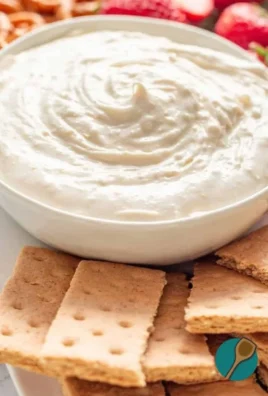 Creamy no bake cheesecake dip served with fresh fruit and graham crackers