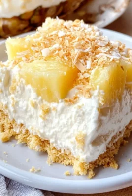 Delicious no-bake pineapple cream dessert served in a glass dish.