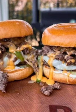 Delicious Philadelphia cheesesteak burger with melted cheese and grilled onions