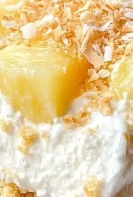Delicious Pineapple Cream Cheese dessert topped with fresh pineapple slices.
