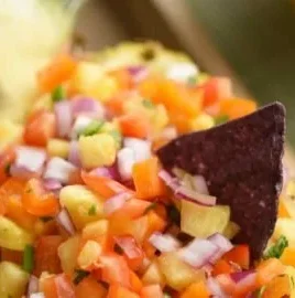 Fresh pineapple salsa with vibrant ingredients in a bowl
