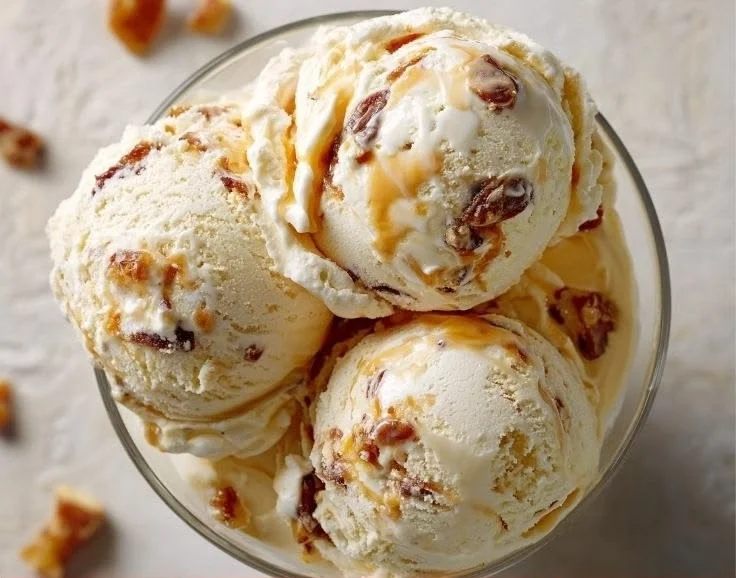 Salted caramel cottage cheese ice cream served in a bowl with a spoon.