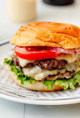 Delicious smash burger with melted cheese and fresh toppings