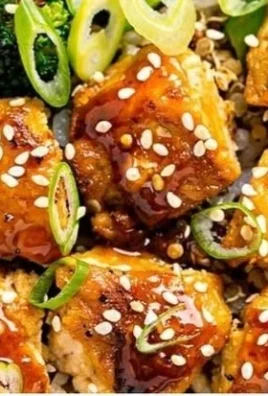 Delicious sticky hot honey garlic chicken bowls garnished with fresh herbs
