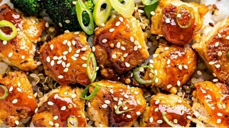 Delicious sticky hot honey garlic chicken bowls garnished with fresh herbs