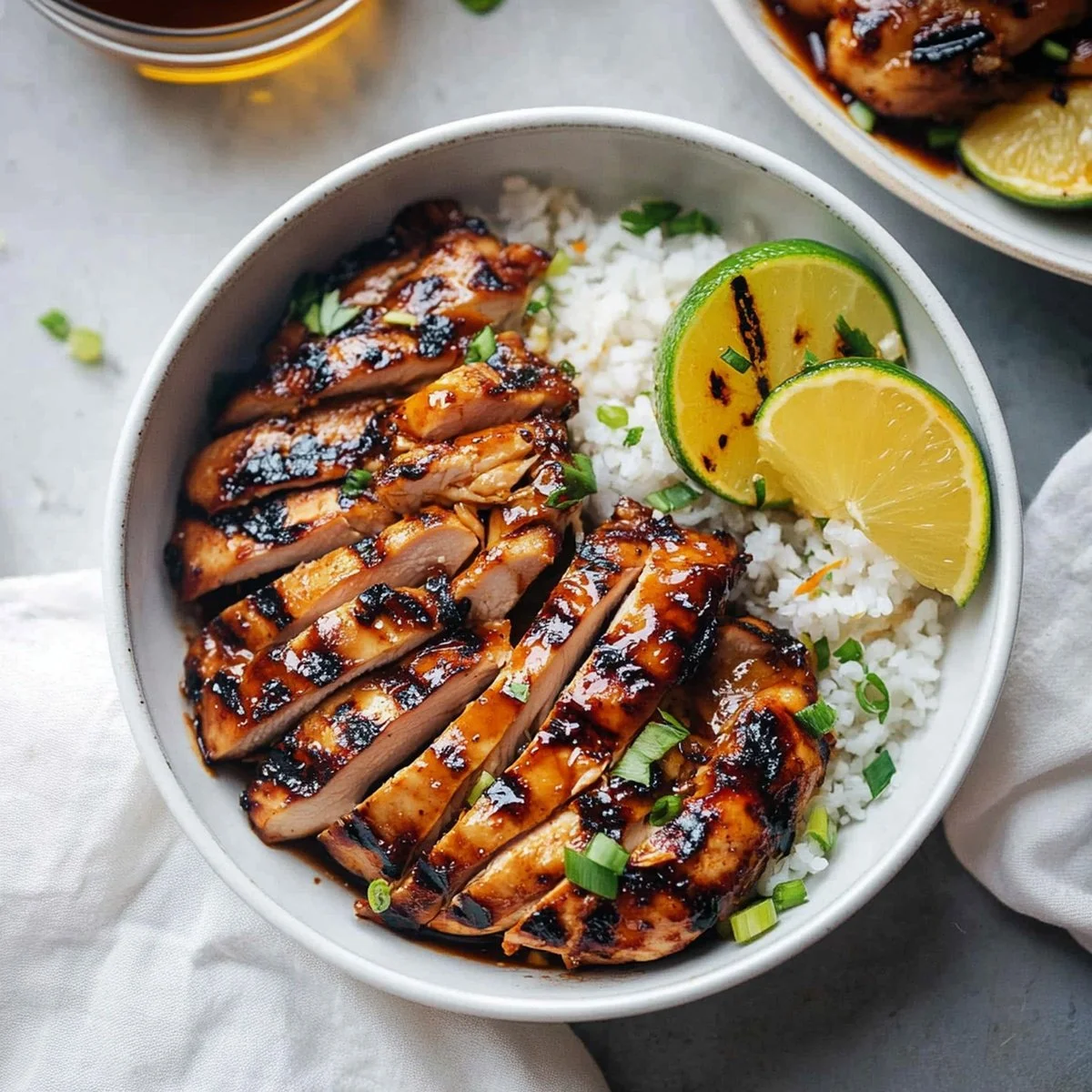 Tangy marinated Asian grilled chicken on the grill