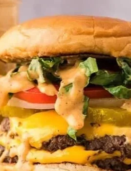 Delicious homemade smash burger with toppings and melted cheese