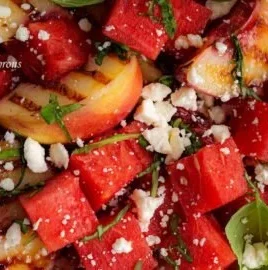 Delicious watermelon and grilled peach salad served in a bowl.