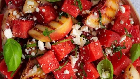 Delicious watermelon and grilled peach salad served in a bowl.