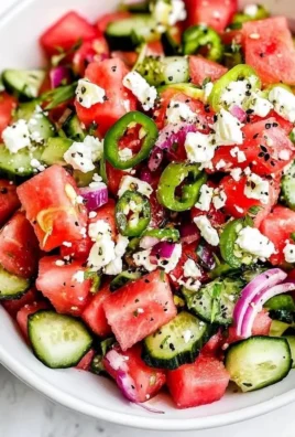 Refreshing watermelon salad with feta cheese and mint leaves