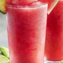 Refreshing Watermelon Strawberry Slush drink in a glass with mint garnish.