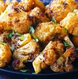 Crispy air fryer cauliflower florets served in a bowl.
