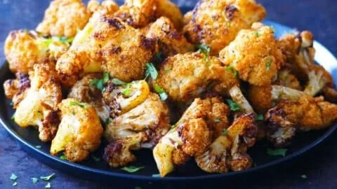 Crispy air fryer cauliflower florets served in a bowl.