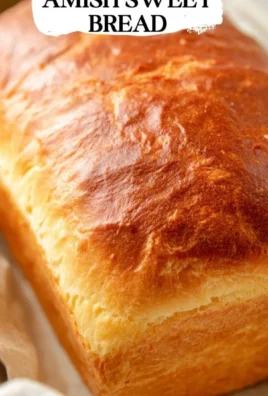 Loaf of homemade Amish Sweet Bread, showcasing its golden crust and soft texture.