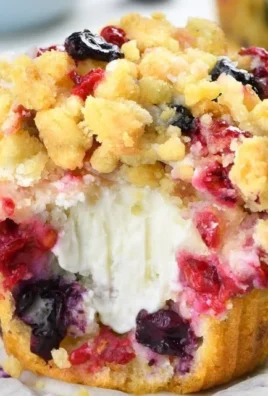 Delicious Berry Cream Cheese Muffins with fresh berries and creamy filling