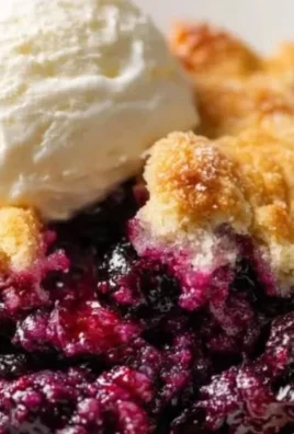 Freshly baked blackberry cobbler with a golden crust and juicy blackberries