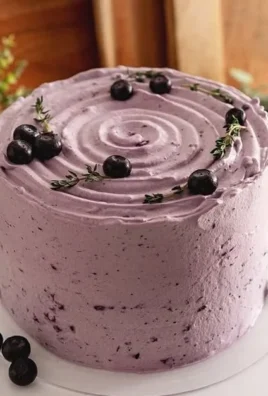 Delicious Blueberry Chiffon Cake topped with fresh blueberries and whipped cream
