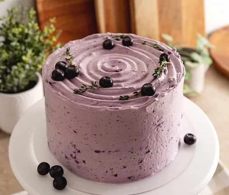 Delicious Blueberry Chiffon Cake topped with fresh blueberries and whipped cream