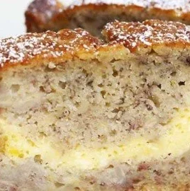 Delicious slice of cheesecake banana bread with cream cheese topping
