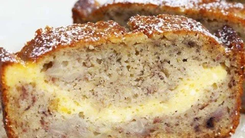 Delicious slice of cheesecake banana bread with cream cheese topping