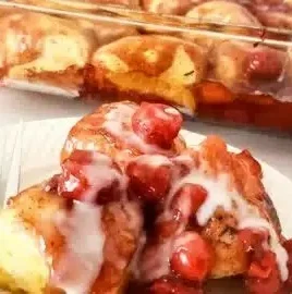 Delicious cherry pie bubble up dessert served in a dish with a scoop of ice cream