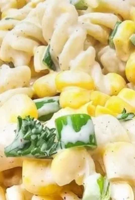 Delicious corn on the cob pasta salad served in a vibrant bowl.