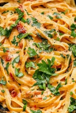 Creamy vegan sun-dried tomato pasta dish served in a bowl