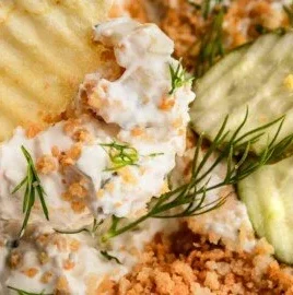 Bowl of easy fried pickle dip served with crackers and fresh pickles
