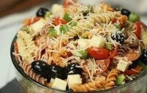 Colorful bowl of easy Italian Pasta Salad with fresh vegetables and dressing