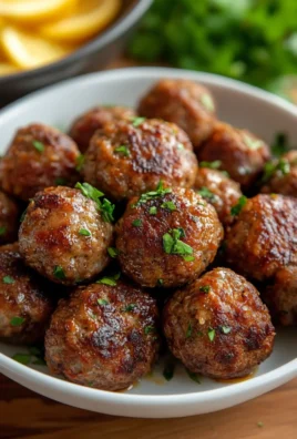 Delicious easy meatball recipe served with spaghetti and marinara sauce.