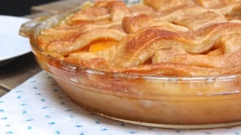 Delicious homemade easy peach cobbler served in a baking dish.