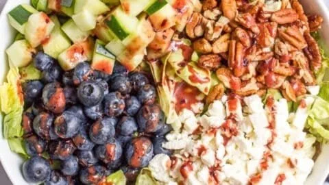 Fresh summer salad with blueberries and mixed greens
